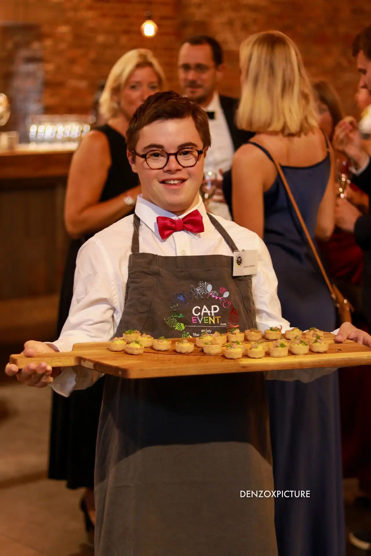 Cap Event ASBL team member serving guests at SILO Brussels